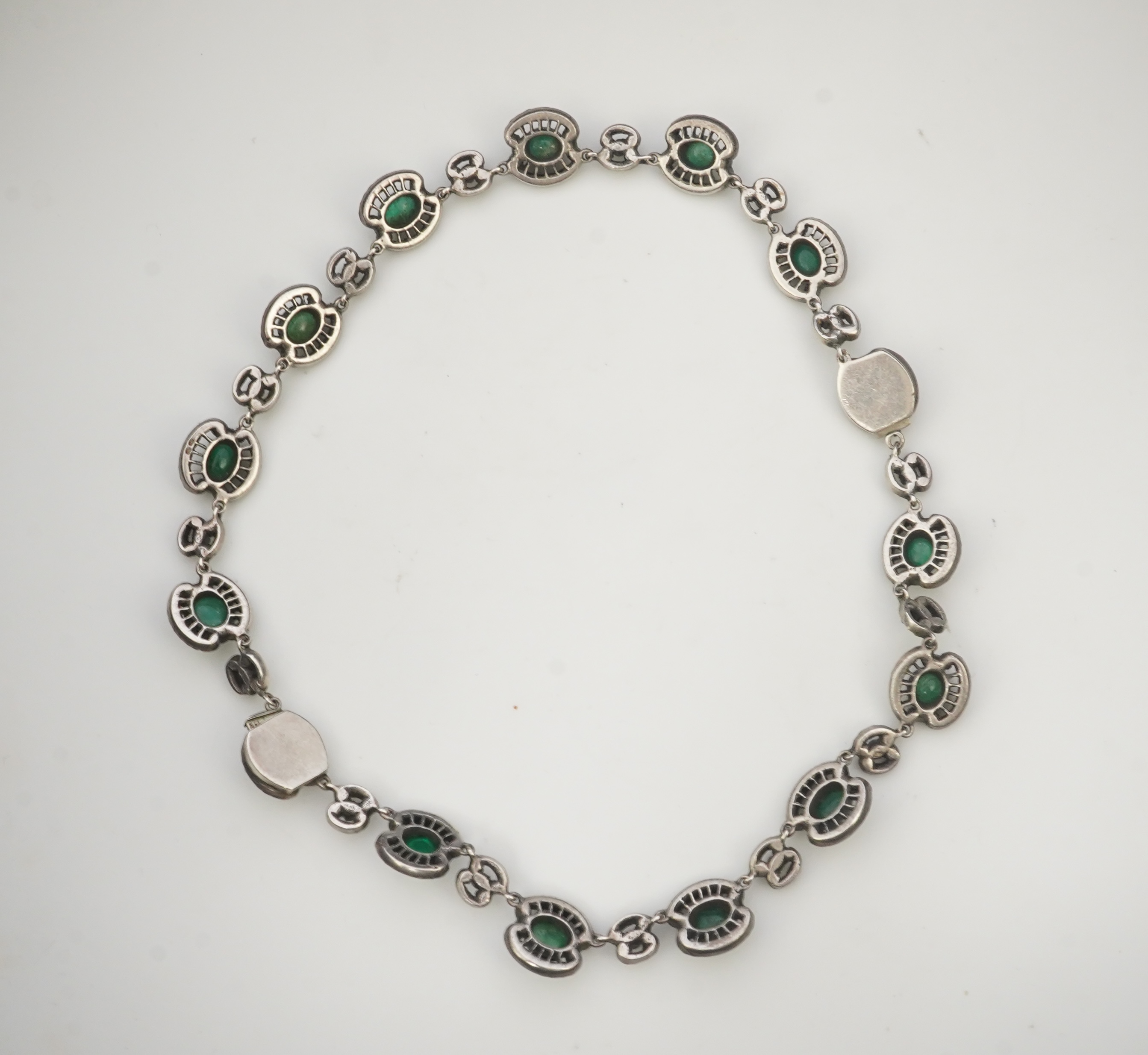 An emerald and rock crystal demi-parure, France, early 20th century